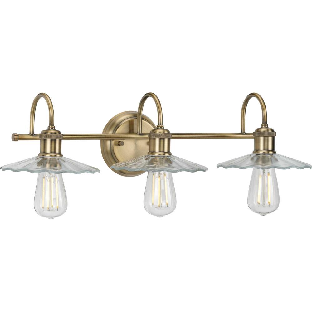 Fayette Collection Three-Light Vintage Brass Clear Glass Farmhouse Bath Vanity Light